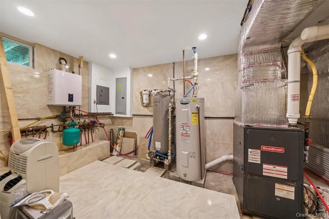 Utilities with water heater and electric panel Utilities with water heater and electric panel