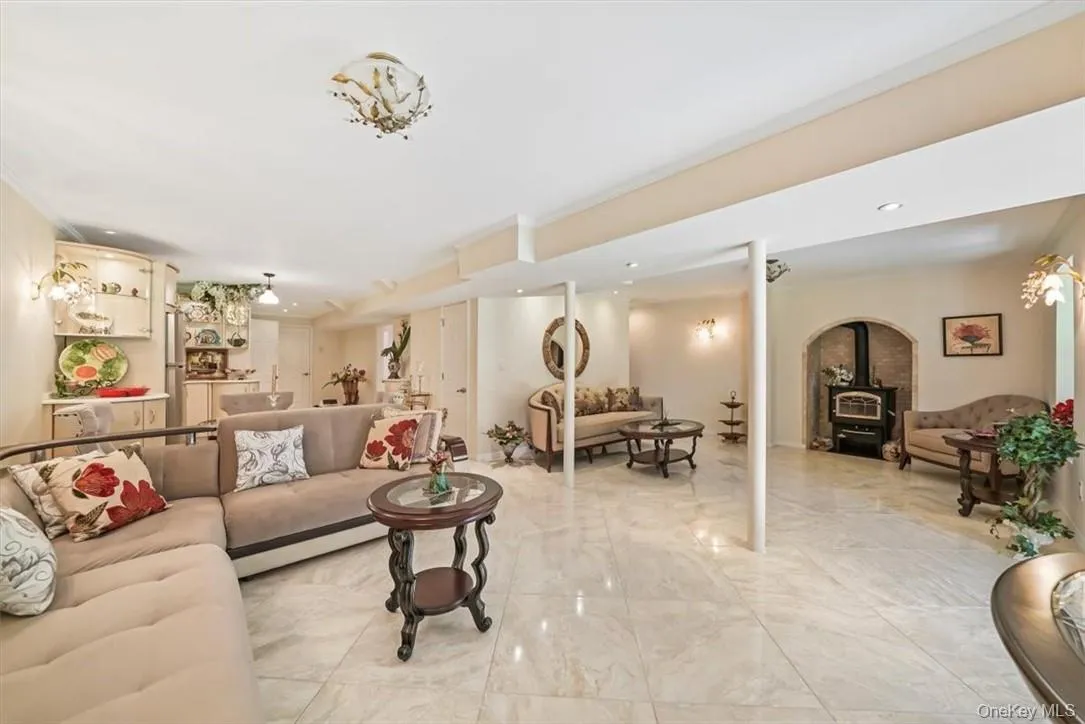 Tiled living room with crown molding and a wood stove Tiled living room with crown molding and a wood stove