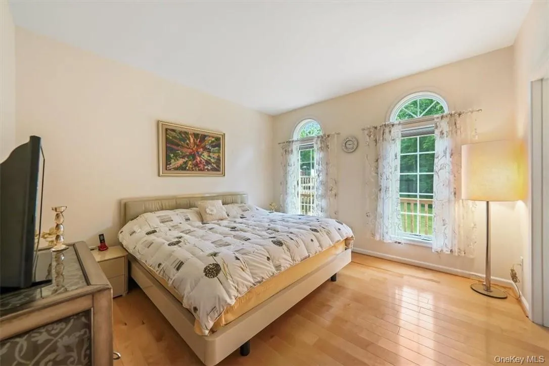 Bedroom with light hardwood / wood-style flooring Bedroom with light hardwood / wood-style flooring