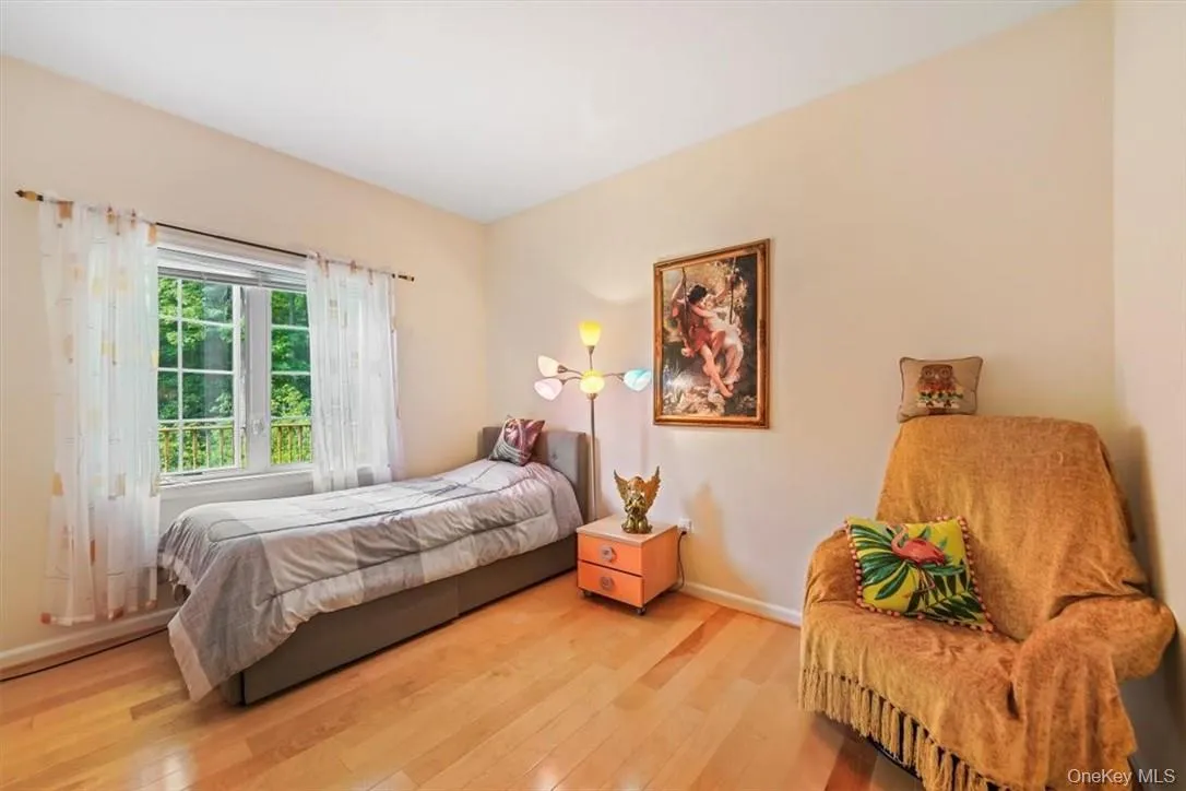 Bedroom with hardwood / wood-style flooring Bedroom with hardwood / wood-style flooring