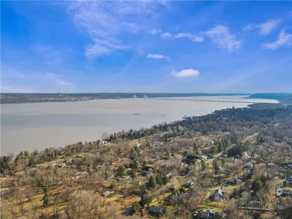 Birds eye view of property featuring a water view Birds eye view of property featuring a water view