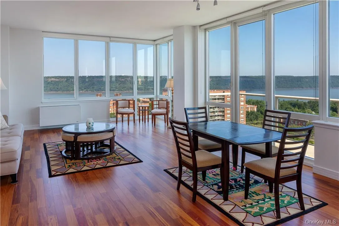 Sunroom / solarium featuring a water view and radiator Sunroom / solarium featuring a water view and radiator