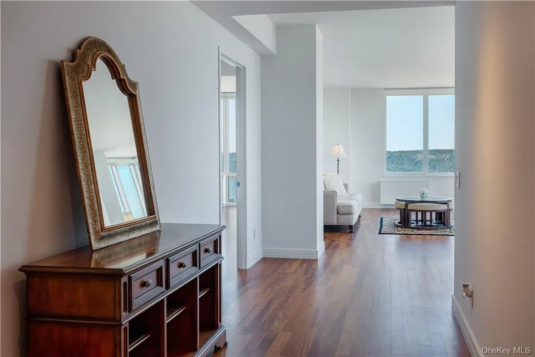 Hallway featuring dark hardwood / wood-style floors Hallway featuring dark hardwood / wood-style floors