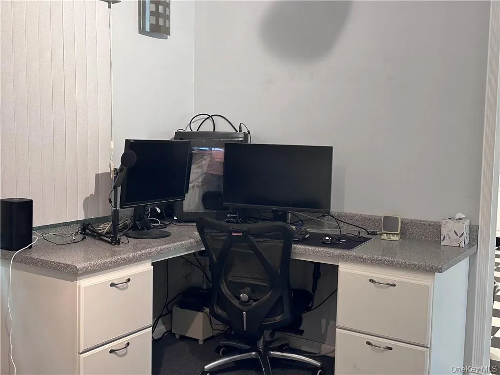 Office featuring built in desk Office featuring built in desk
