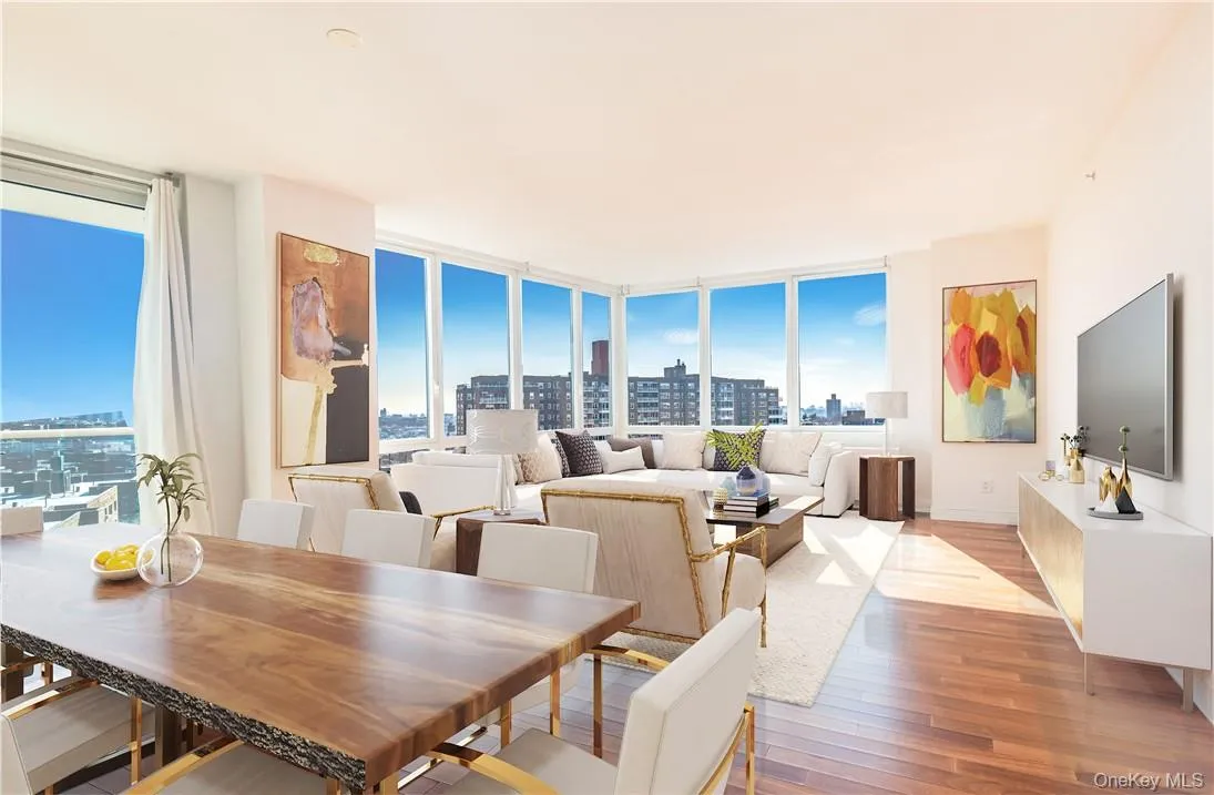 Dining room featuring expansive windows and light wood-type flooring Dining room featuring expansive windows and light wood-type flooring