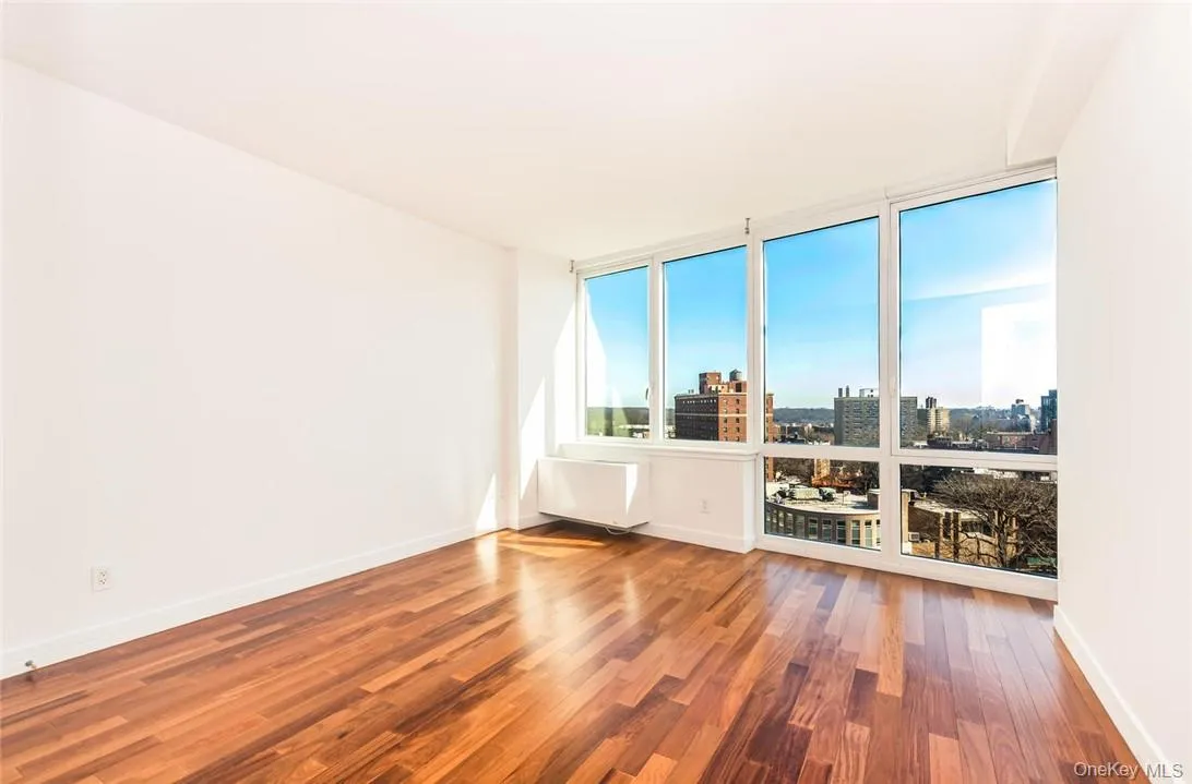 Unfurnished room with hardwood / wood-style flooring Unfurnished room with hardwood / wood-style flooring