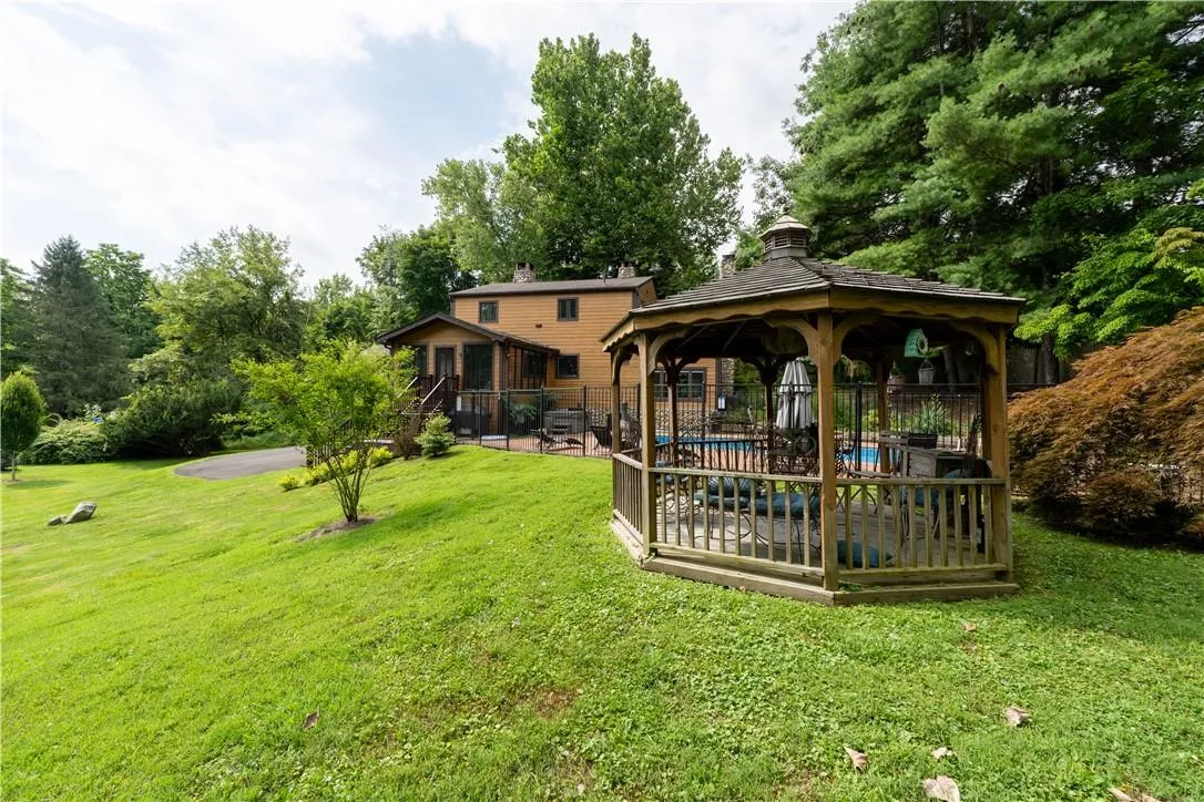 View of yard with a patio, a gazebo, and a swimming pool View of yard with a patio, a gazebo, and a swimming pool