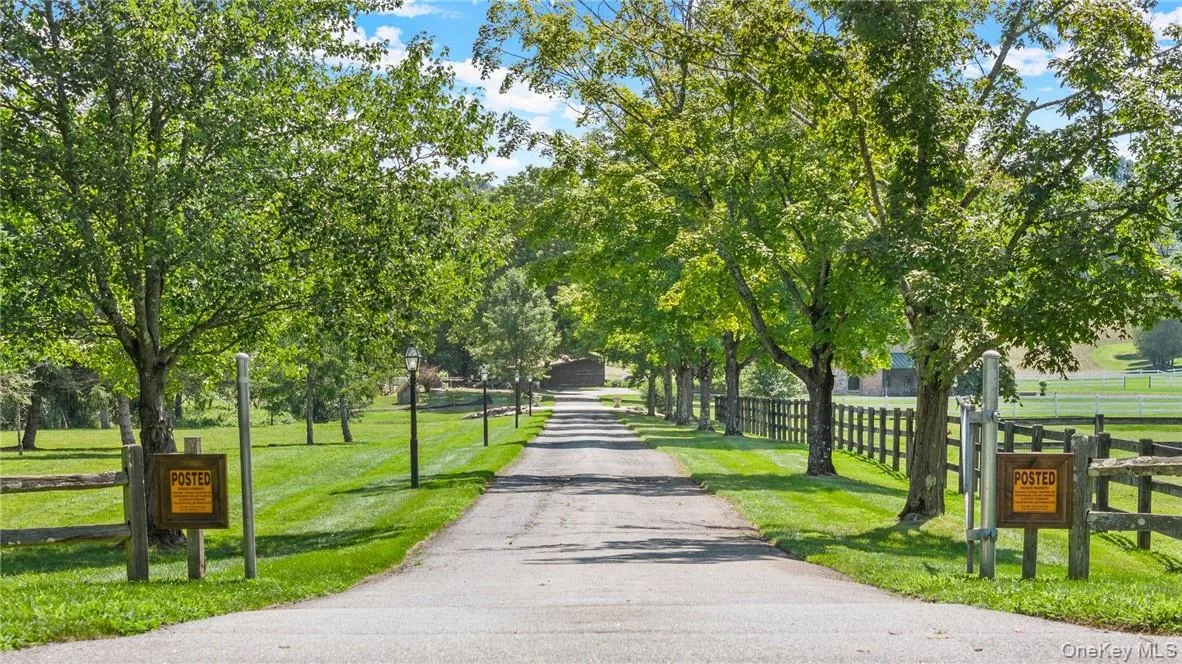 View of property's community with a yard View of property's community with a yard
