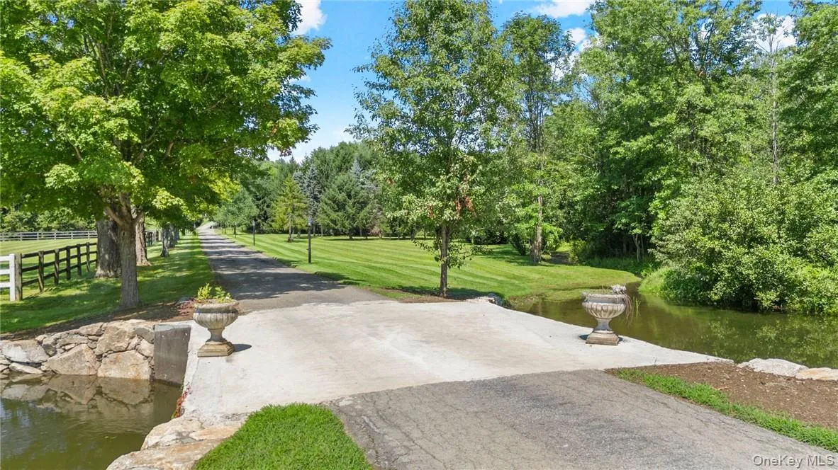 Surrounding community with a water view and a lawn Surrounding community with a water view and a lawn