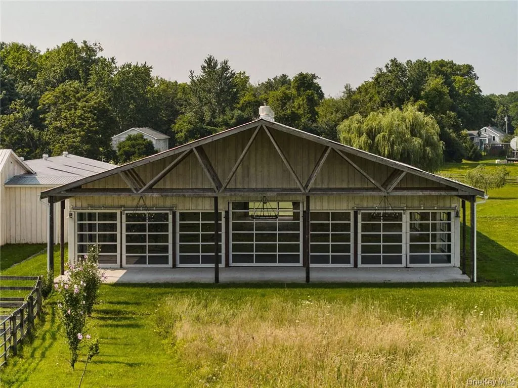 Rear view of property featuring a lawn Rear view of property featuring a lawn