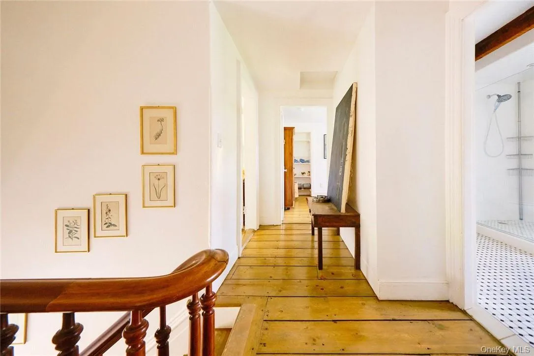 Hallway with light hardwood / wood-style flooring Hallway with light hardwood / wood-style flooring