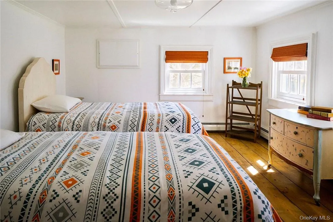 Bedroom featuring hardwood / wood-style floors Bedroom featuring hardwood / wood-style floors