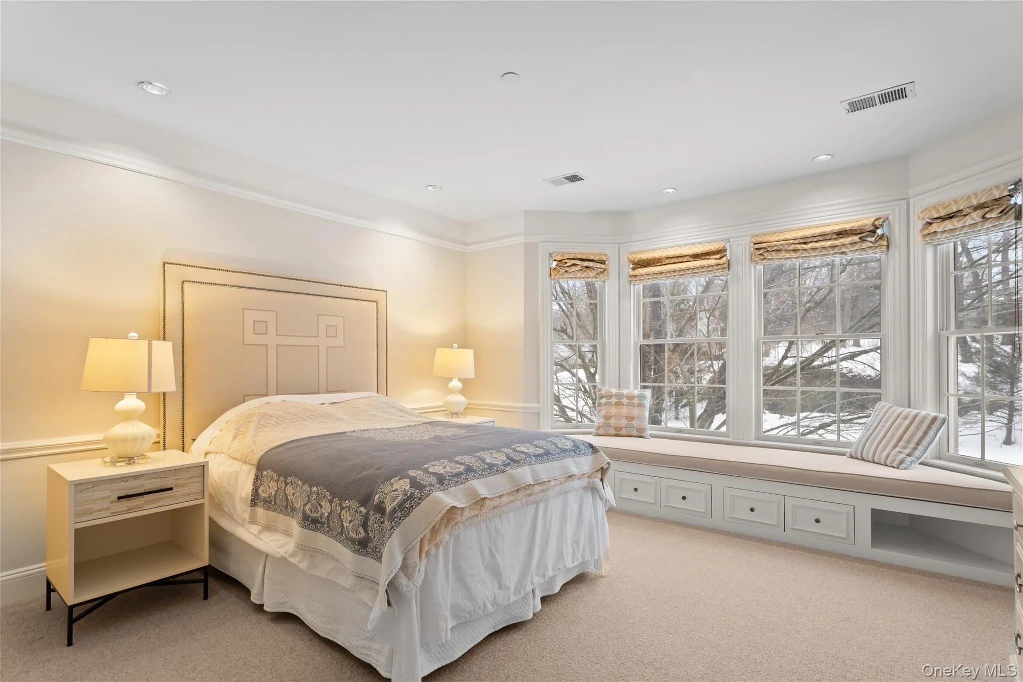 Bedroom featuring light carpet Bedroom featuring light carpet
