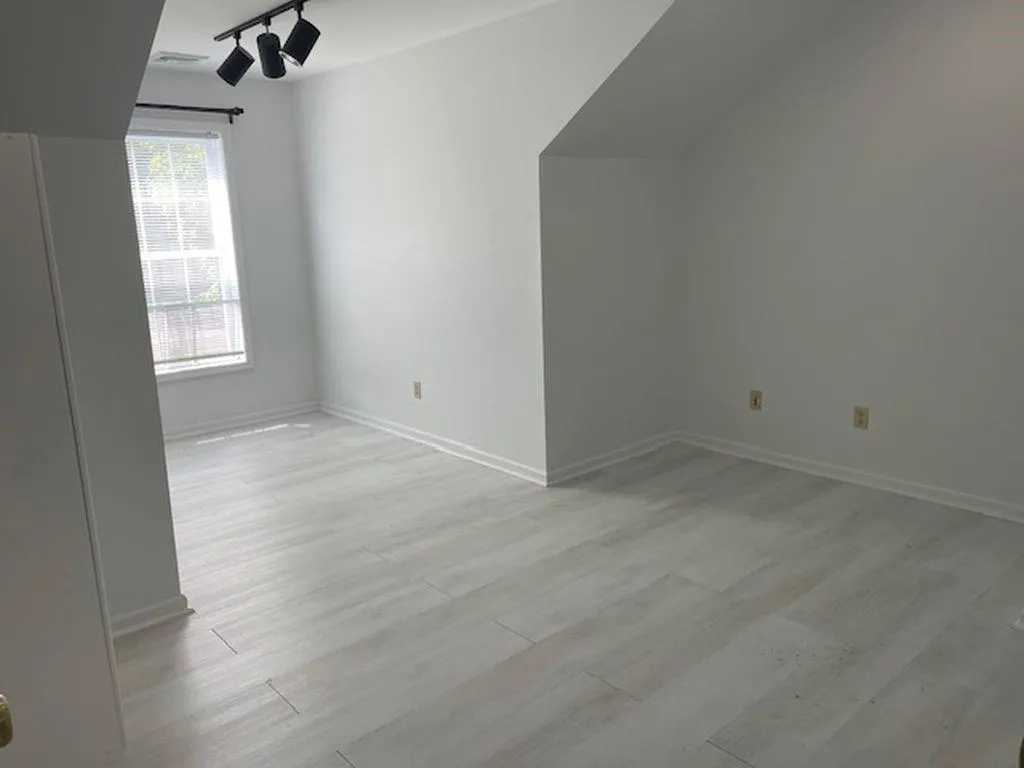 Bonus room featuring light wood-type flooring Bonus room featuring light wood-type flooring