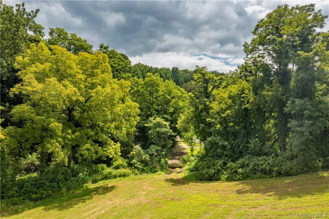 Access drive from Birch Hill Road. Property has about 300 feet of frontage on Birch Hill Road in two sections. Access drive from Birch Hill Road. Property has about 300 feet of frontage on Birch Hill Road in two sections.
