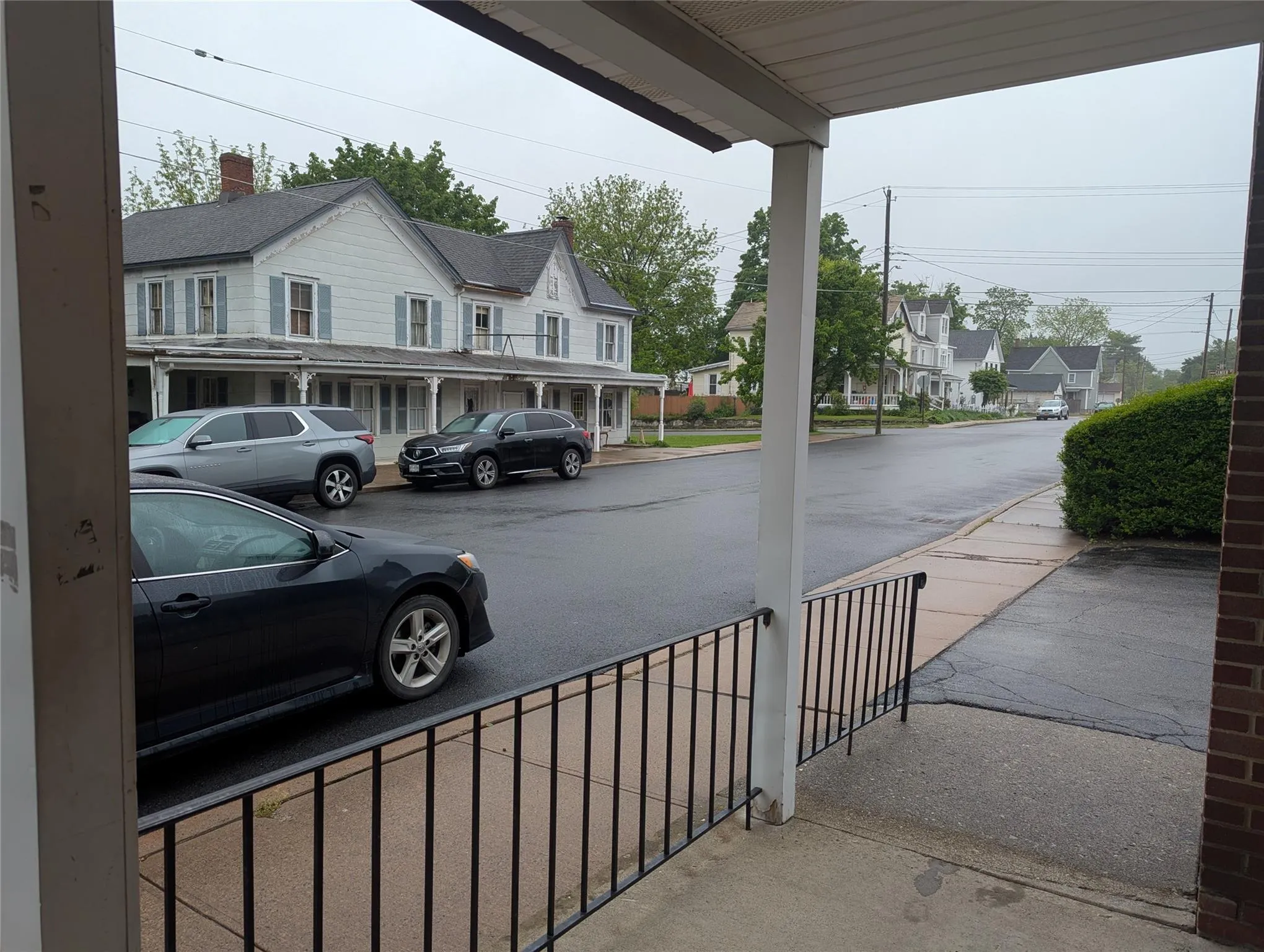View of asphalt road featuring a residential view View of asphalt road featuring a residential view
