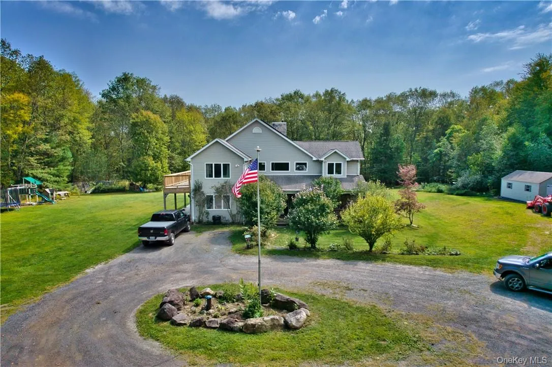 View of front of home with a playground and a front lawn View of front of home with a playground and a front lawn