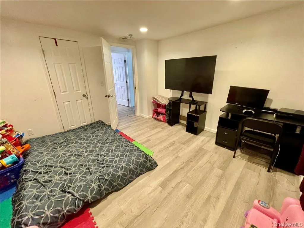 Bedroom featuring light wood-type flooring Bedroom featuring light wood-type flooring