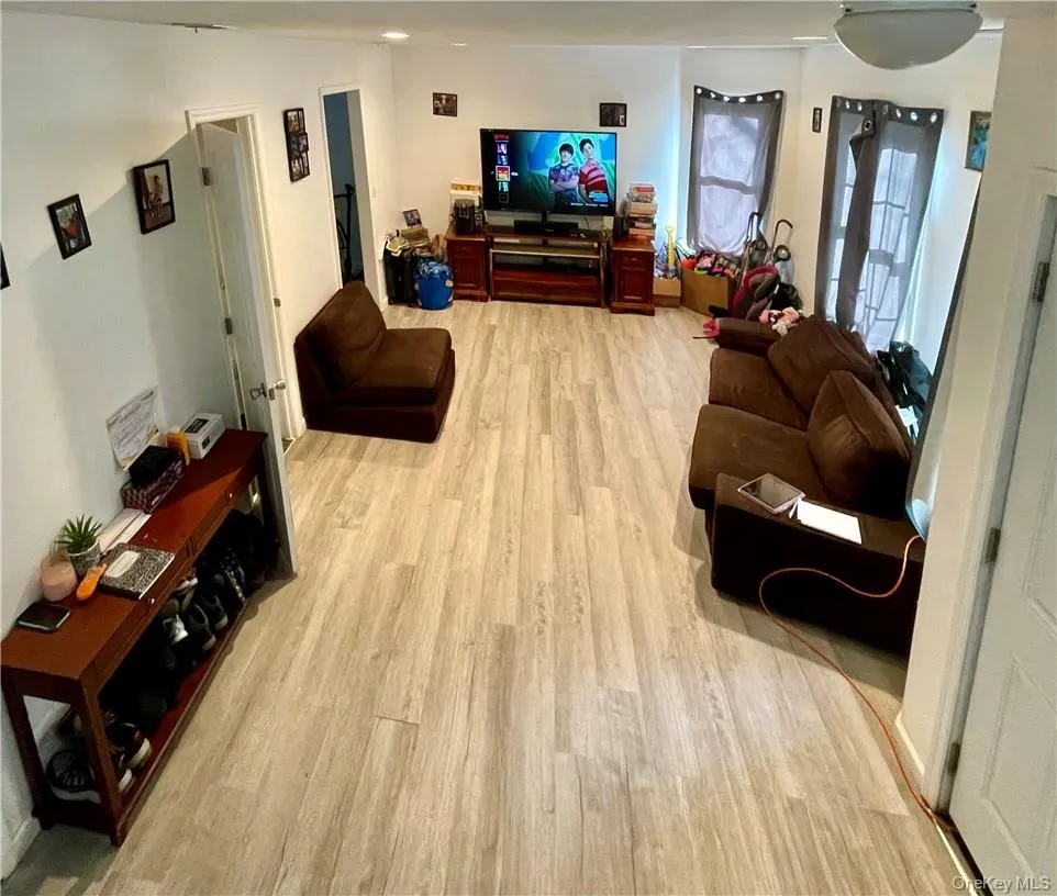 Living room featuring light hardwood / wood-style flooring Living room featuring light hardwood / wood-style flooring