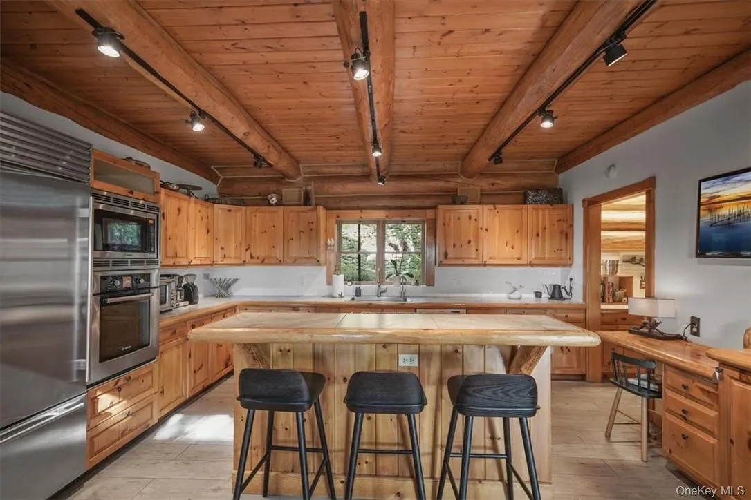 Spacious kitchen with all recently updated appliances. A spacious mud room with storage and access to the property is just off to the left. Spacious kitchen with all recently updated appliances. A spacious mud room with storage and access to the property is just off to the left.