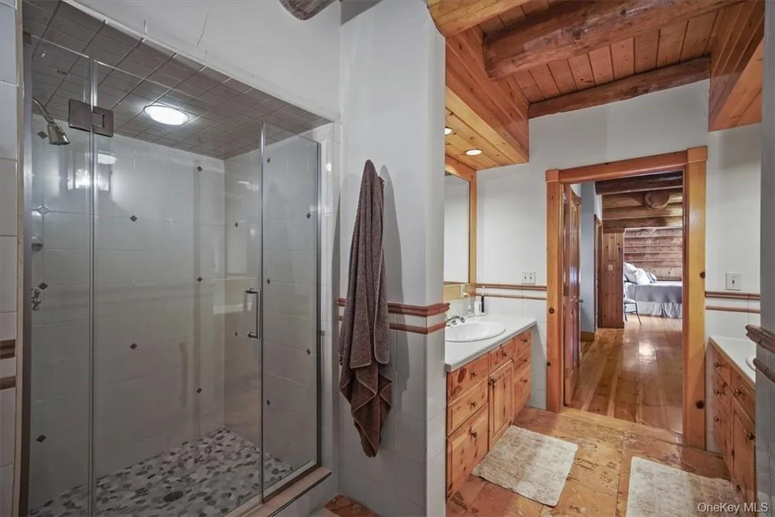 Primary bath - large shower and dual vanity areas with storage; private WC Primary bath - large shower and dual vanity areas with storage; private WC
