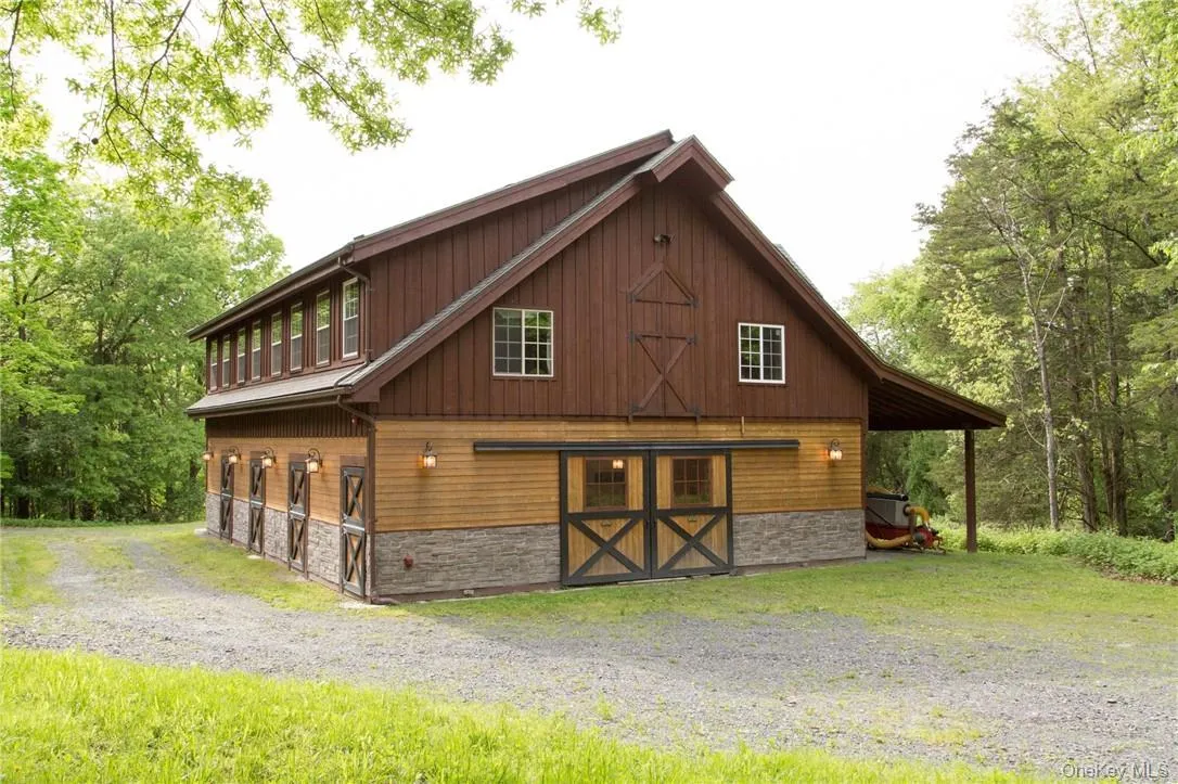 6 Stall horse barn with wash stall, storage and carriage house apartment with kitchen and bath. 6 Stall horse barn with wash stall, storage and carriage house apartment with kitchen and bath.