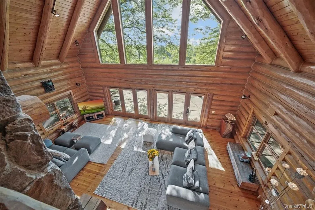 Great room with magnificent westerly views, walls of windows and cathedral ceiling. There is in-house sound, under ground electric, a whole house generator, and owned propane tanks. Great room with magnificent westerly views, walls of windows and cathedral ceiling. There is in-house sound, under ground electric, a whole house generator, and owned propane tanks.