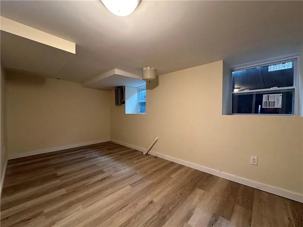 Basement featuring wood-type flooring Basement featuring wood-type flooring