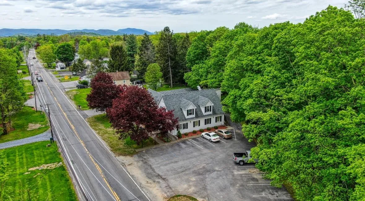 Birds eye view of property with a mountain view Birds eye view of property with a mountain view