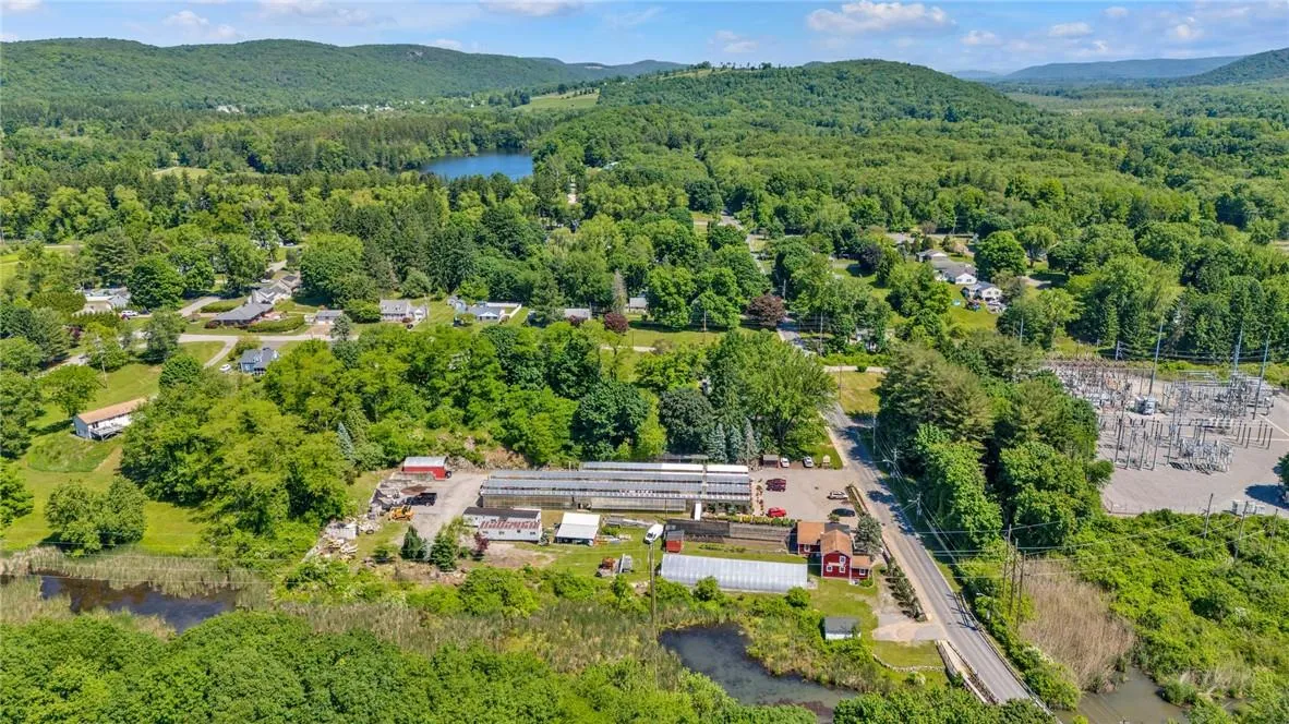 Birds eye view of property featuring a water and mountain view Birds eye view of property featuring a water and mountain view