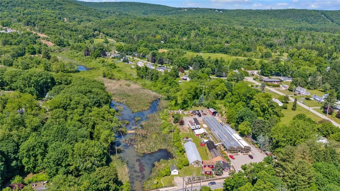 Birds eye view of property with a water view Birds eye view of property with a water view