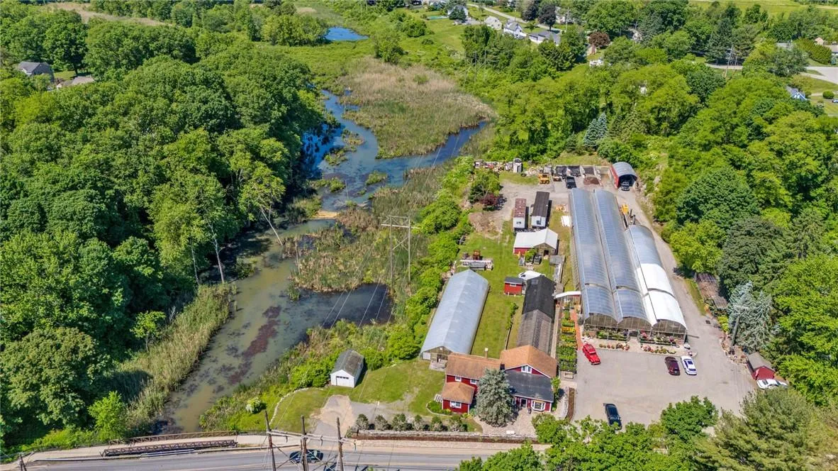 Aerial view featuring a water view Aerial view featuring a water view