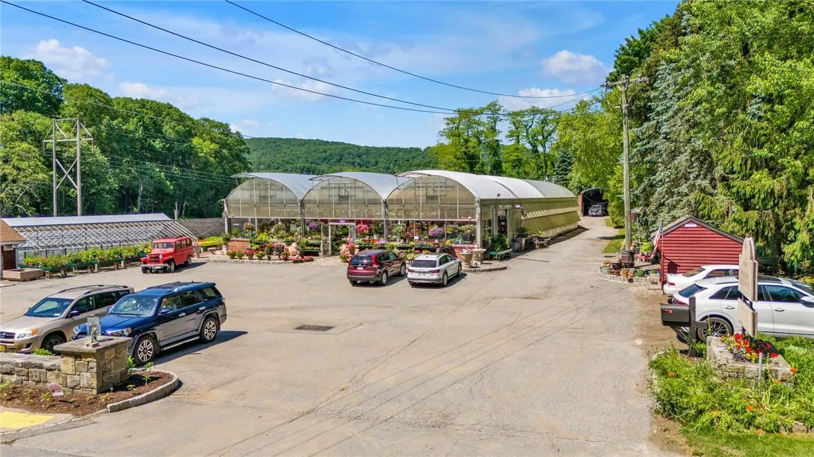 View of car parking featuring a carport View of car parking featuring a carport