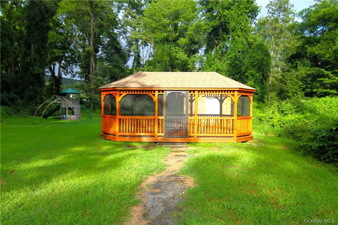 View of front facade featuring a playground, a gazebo, and a front lawn View of front facade featuring a playground, a gazebo, and a front lawn