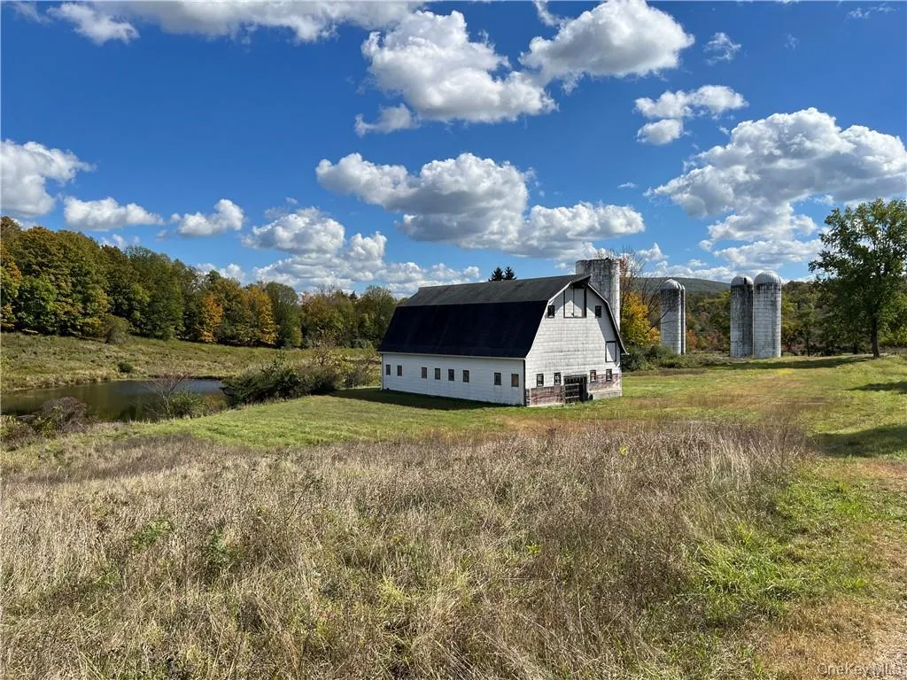 View of outbuilding featuring a water view View of outbuilding featuring a water view