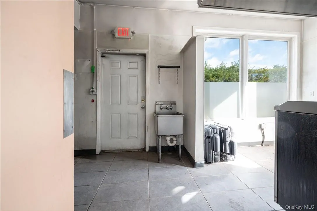 Hallway with light tile patterned flooring Hallway with light tile patterned flooring