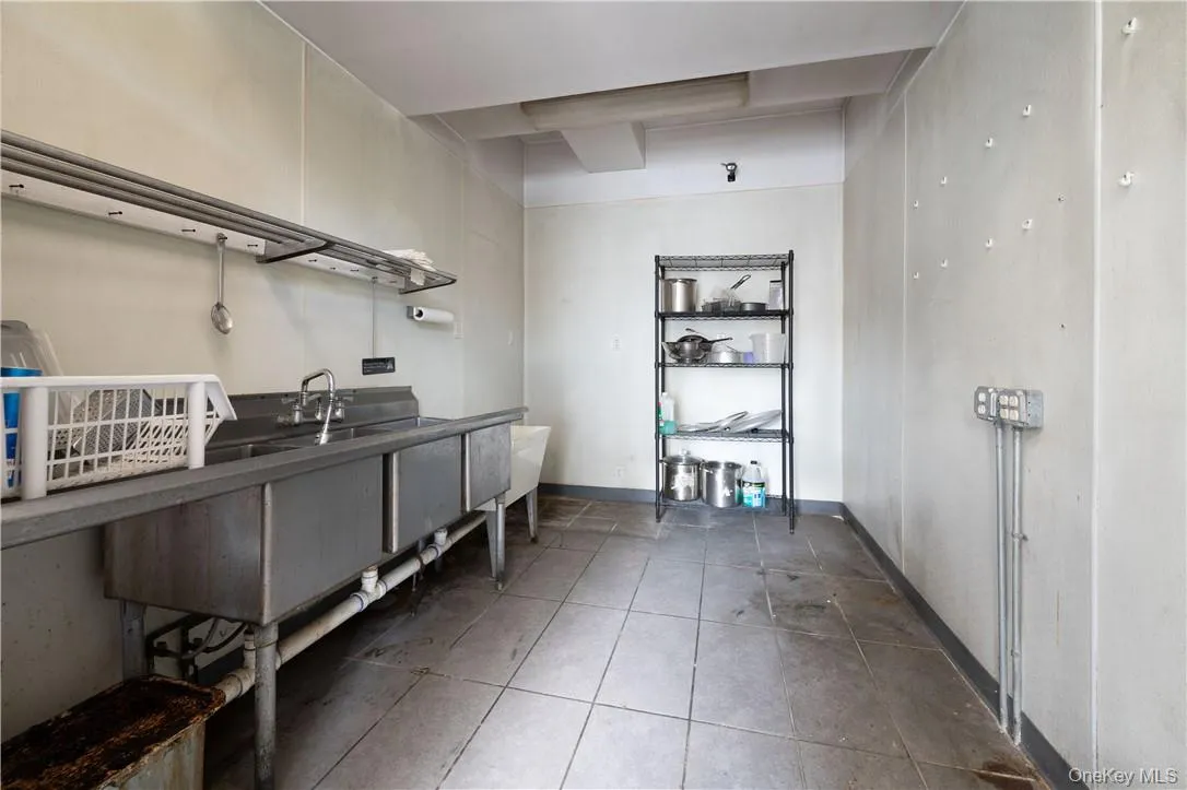 Washroom featuring dark tile patterned flooring Washroom featuring dark tile patterned flooring