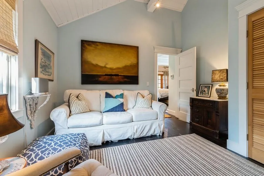 Living room featuring high vaulted ceiling and dark hardwood / wood-style flooring Living room featuring high vaulted ceiling and dark hardwood / wood-style flooring