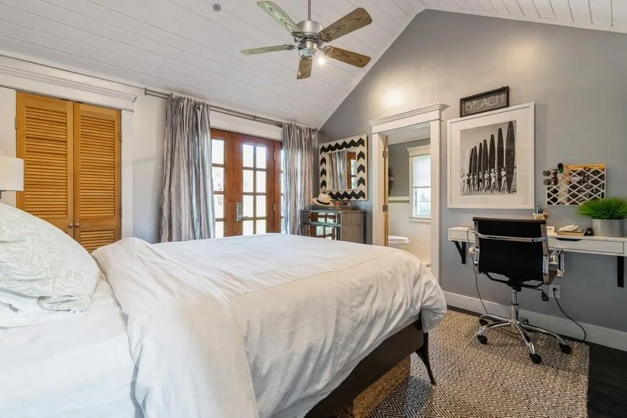 Bedroom featuring ensuite bathroom, wood ceiling, a closet, ceiling fan, and vaulted ceiling Bedroom featuring ensuite bathroom, wood ceiling, a closet, ceiling fan, and vaulted ceiling