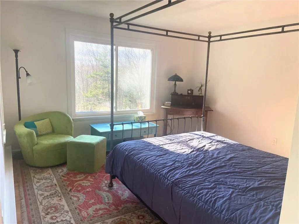 Bedroom featuring multiple windows Bedroom featuring multiple windows