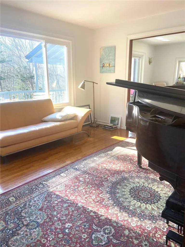 Sitting room with hardwood / wood-style flooring Sitting room with hardwood / wood-style flooring
