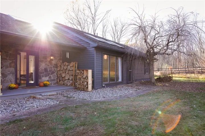 View of property exterior featuring a yard