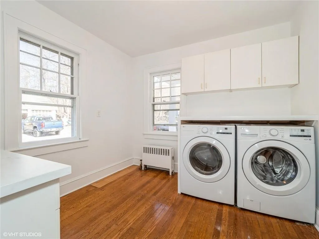 The main floor also features a laundry and utility room. The main floor also features a laundry and utility room.