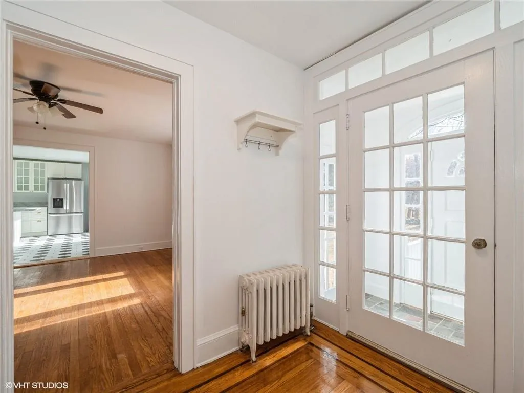 A view of the dining room and kitchen from the formal entryway. A view of the dining room and kitchen from the formal entryway.
