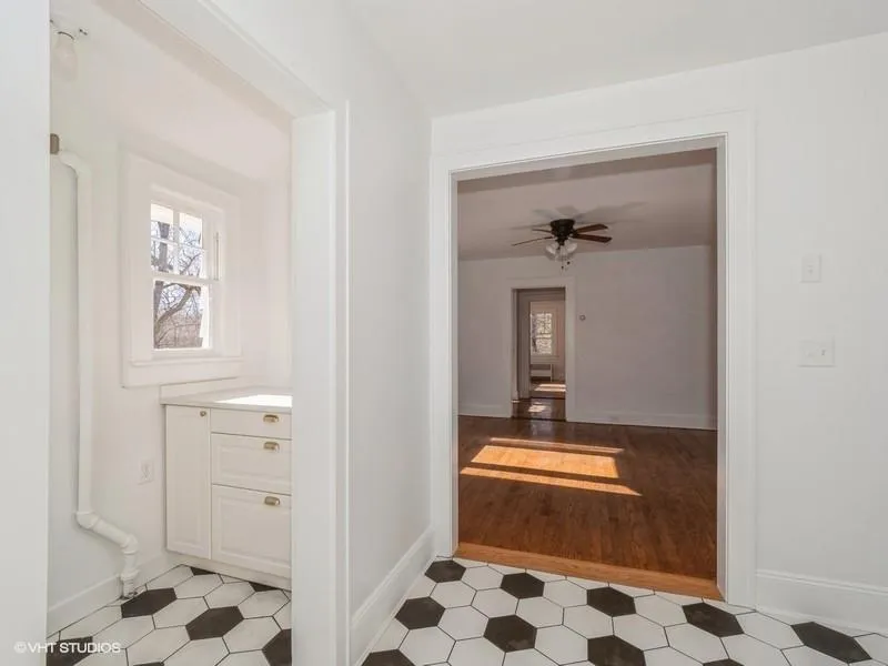 A view of the kitchen pantry and dining room. A view of the kitchen pantry and dining room.