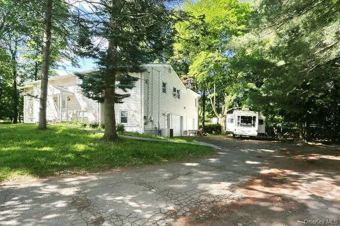 View of side of property with a yard View of side of property with a yard