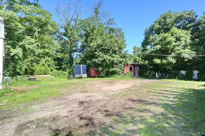 View of yard featuring a storage shed View of yard featuring a storage shed