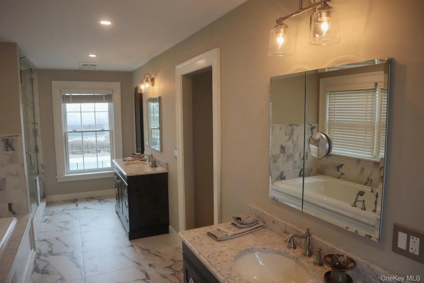 Bathroom featuring vanity and independent shower and bath Bathroom featuring vanity and independent shower and bath