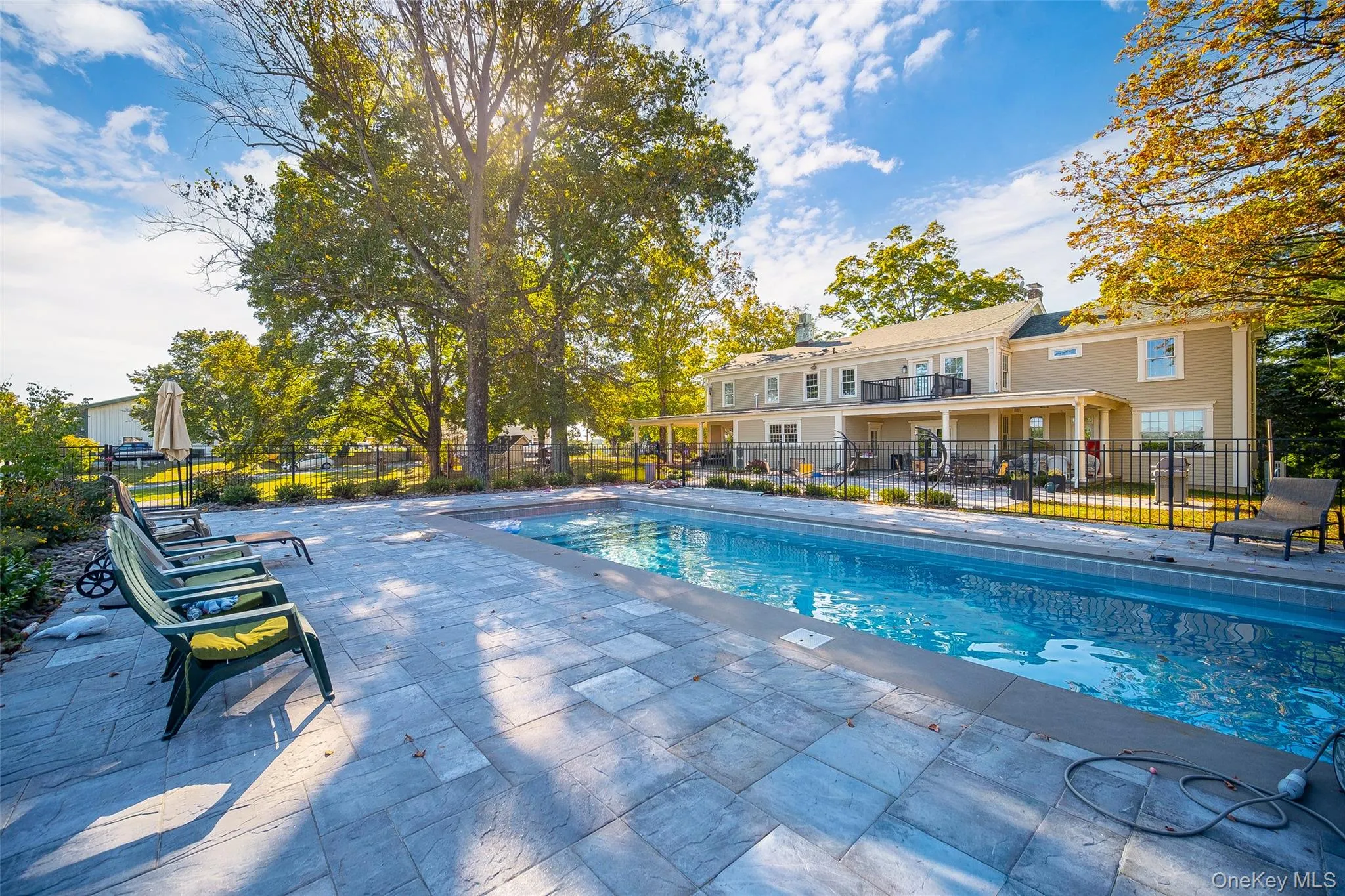 View of swimming pool with a patio area View of swimming pool with a patio area