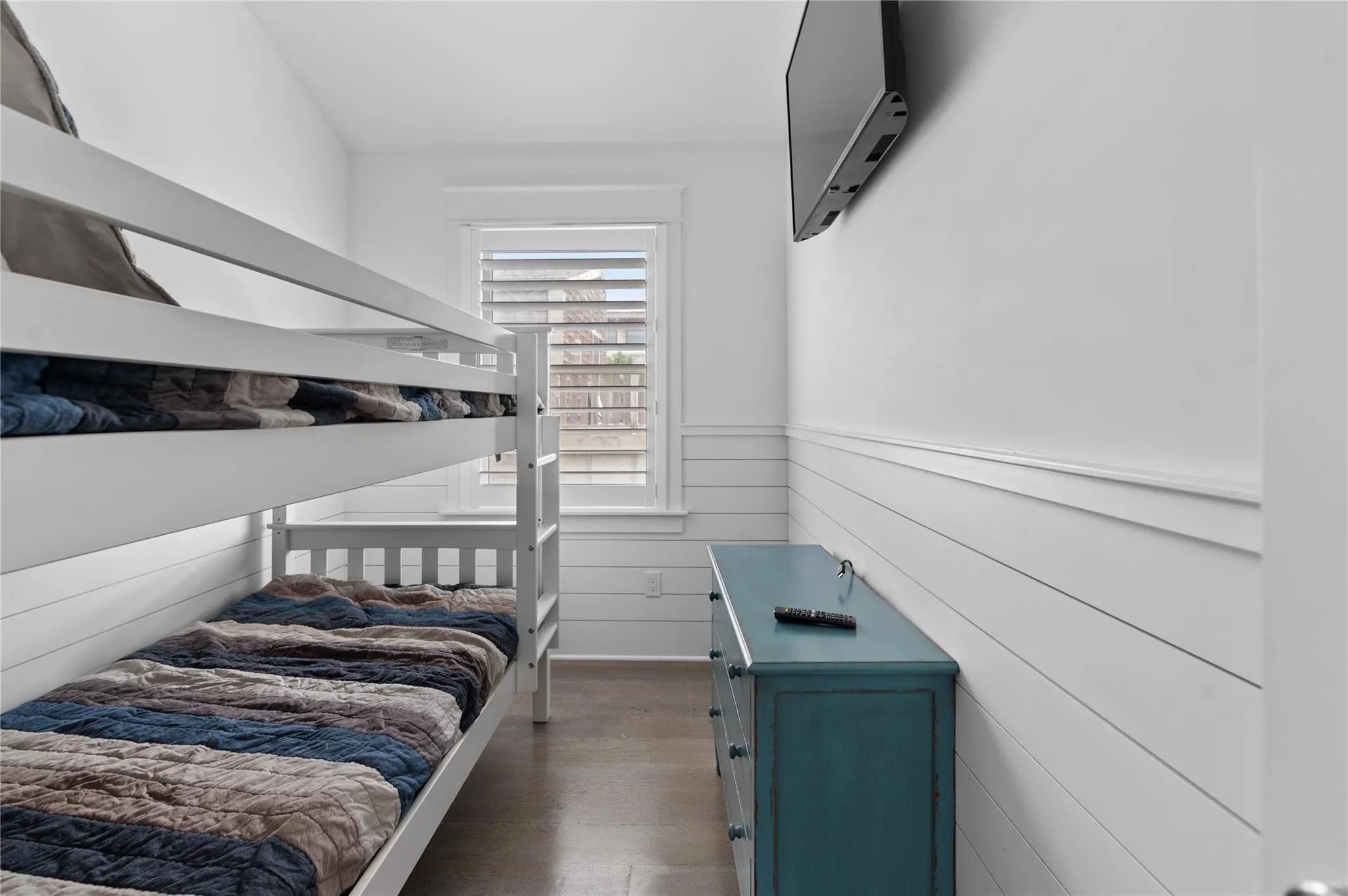 Bedroom with dark hardwood / wood-style flooring Bedroom with dark hardwood / wood-style flooring